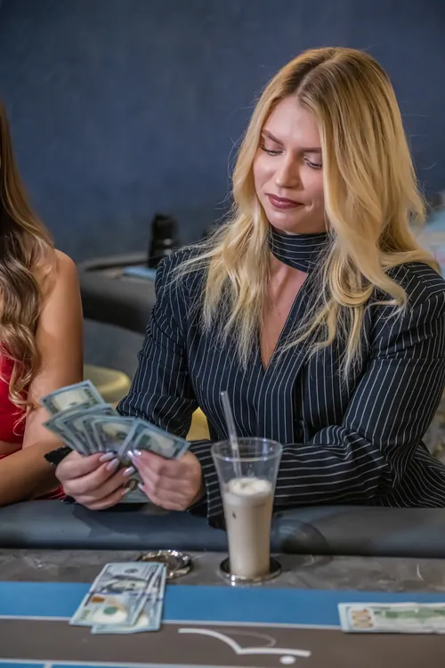 A guest counting her winnings at the table